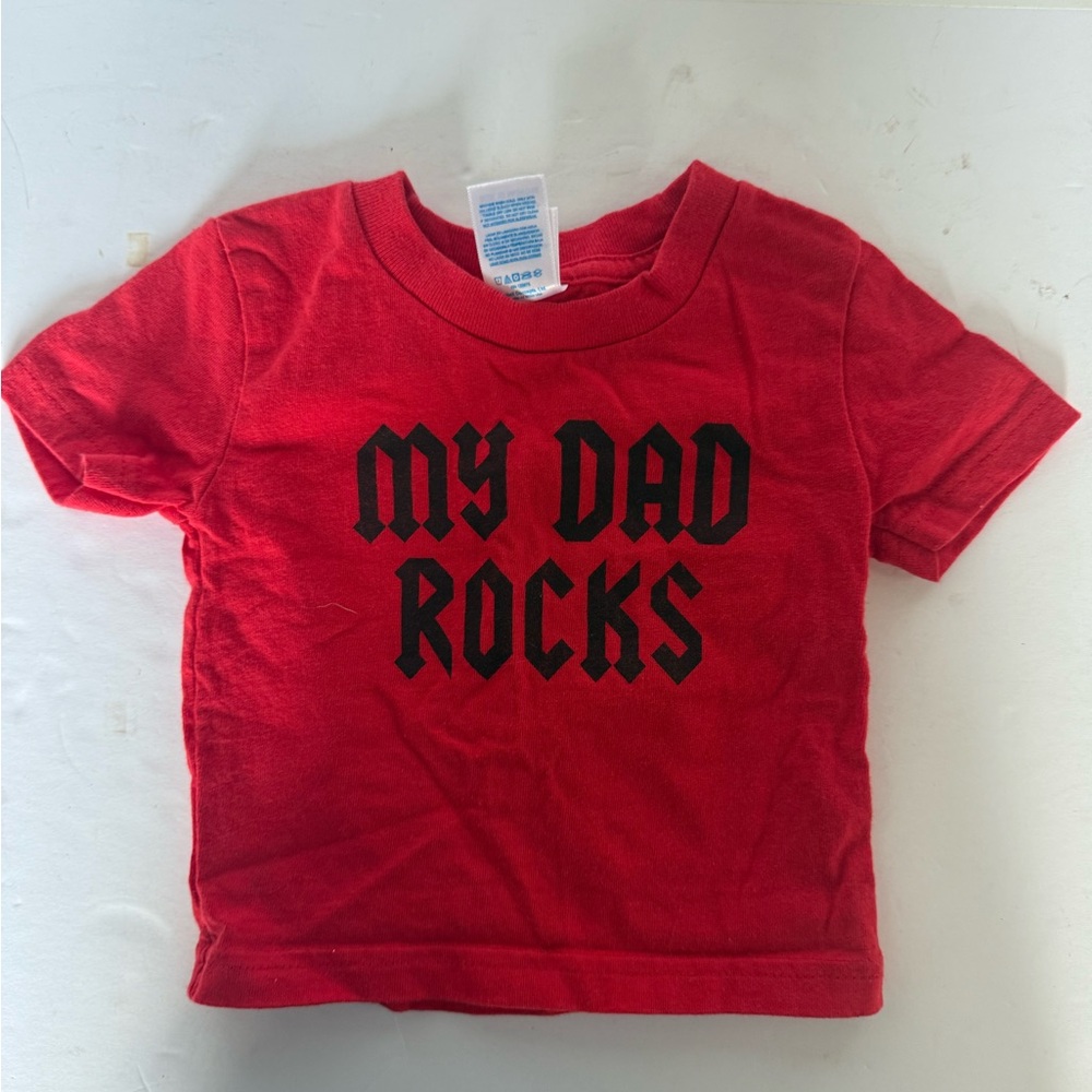 My dad, rocks, red T-shirt